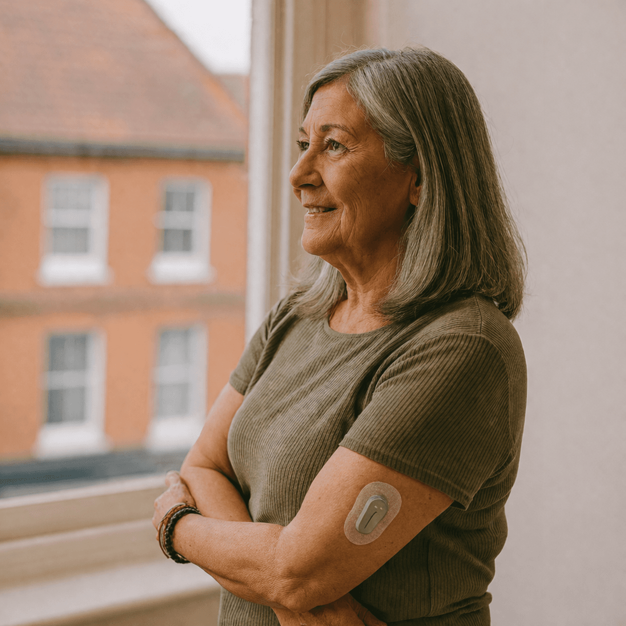 Woman wearing a continuous glucose monitor
